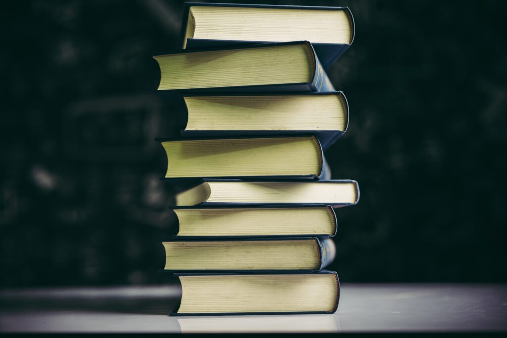 The books are placed in a stack of books on the table The books are placed in a stack of books on the table